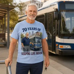 Worn mockup of bus driver gift shirt with 70 years of keeping life moving artwork