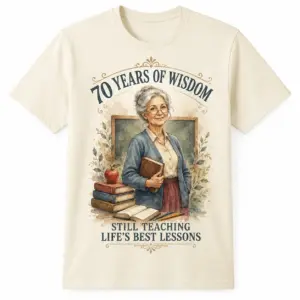 Front view of 70th birthday teacher shirt with 70 Years of Wisdom artwork, teacher illustration, books, apple, and chalkboard