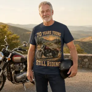 Lifestyle view of 70th birthday motorcycle shirt with 70 Years Young Still Riding vintage cruiser design