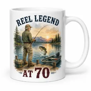 White ceramic mug with REEL LEGEND AT 70 fishing birthday artwork showing an older fisherman and jumping bass